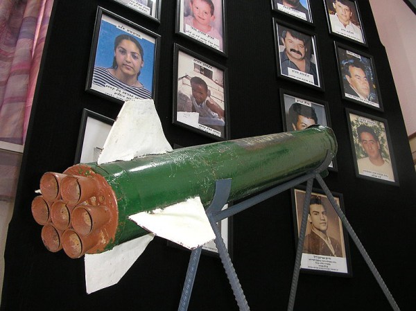 A_Qassam_rocket_is_displayed_in_Sderot_town_hall_against_a_background_of_pictures_of_residents_killed_in_rocket_attacks