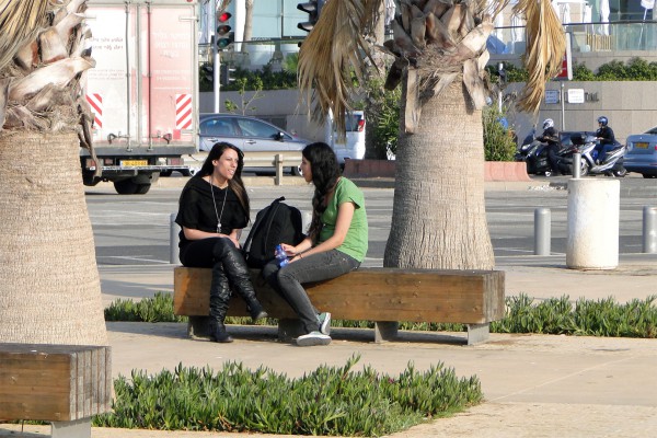 Photo-of-Tel-Aviv-Women-Sitting-Together-on-Promenade