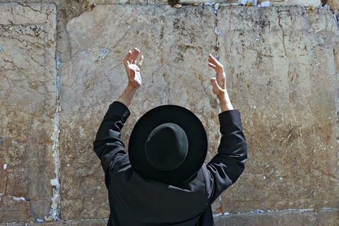 Ultra-Orthodox man-lifting hands-prayer-Kotel-Western Wall