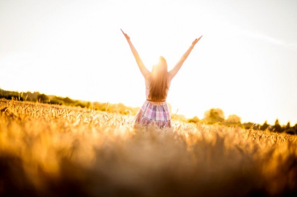 woman-raises-her-hands-to-God-in-worship