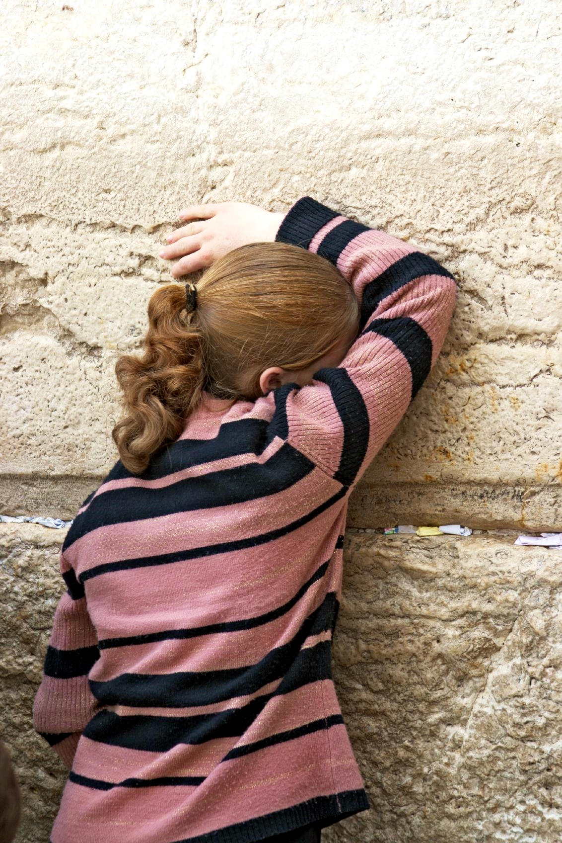 A girl prays at the Western (Wailing) Wall in the Old City of Jerusalem.