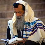 Orthodox Jewish man in prayer-tallit-tefillin