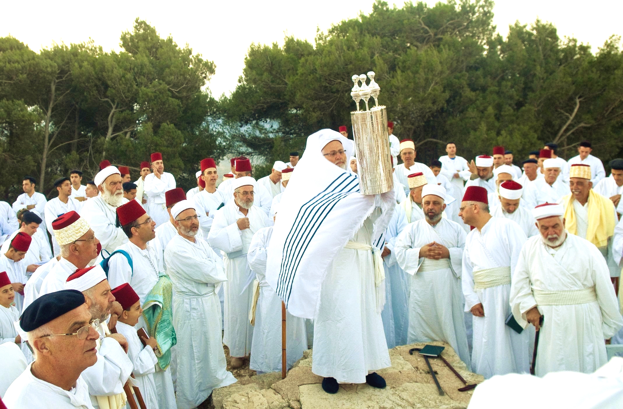 Samaritans lift the Torah on Mount Gerizim during Shavuot, otherwise called Pentecost or the Feast of Weeks.