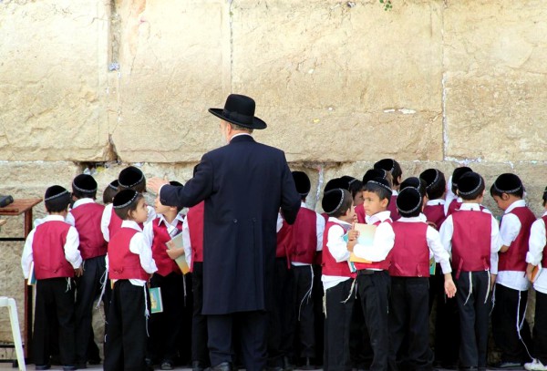 Young Israeli students come to the Western (Wailing) Wall to pray.