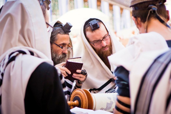 Jewish men pray together in Jerusalem