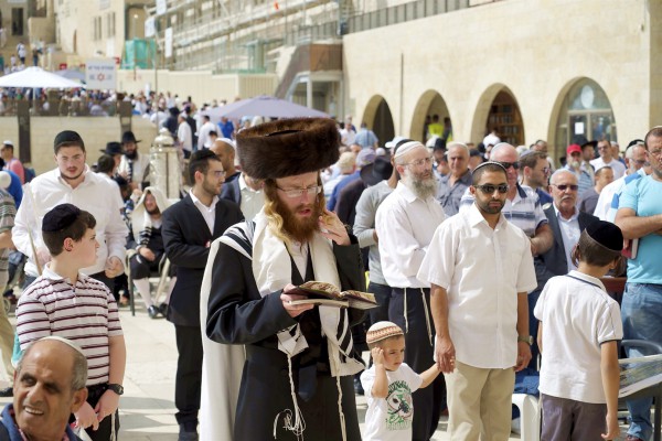 Jewish men pray at the Western (Wailing) Wall in Jerusalem