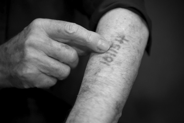 An 80-year-old Holocaust survivor living in Tiberias, Israel, shows the tattoo the Nazis marked him with in a concentration camp during the Holocaust.