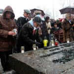 Holocaust survivors light memorial candles at the 63rd anniversary of the liberation of Auschwitz.