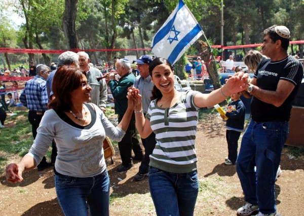 Two women joyfully dance on Jerusalem day to celebrate the miracle of the rebirth of the independent state of Israel.