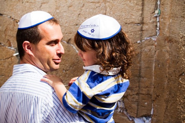 A father and son prepare to pray at the Western (Wailing) Wall.