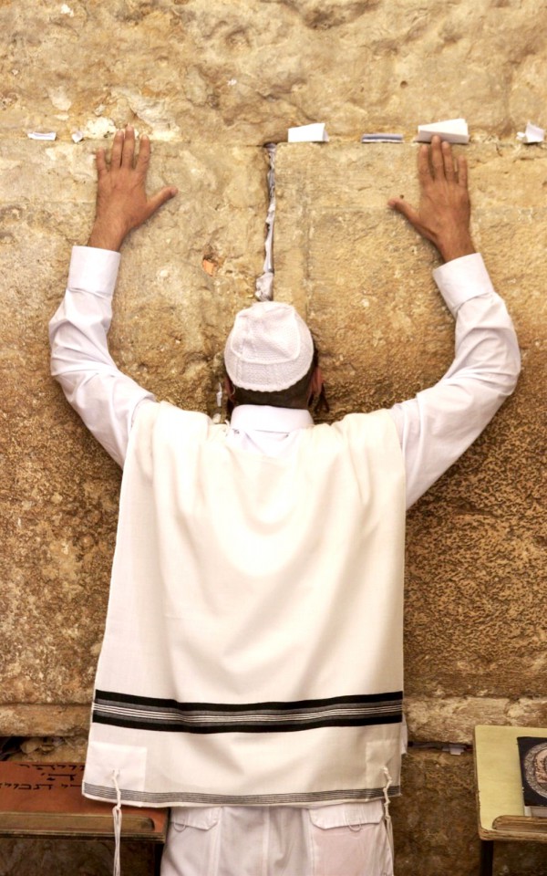 A Jewish man prays at the Western (Wailing) Wall in Jerusalem. (Photo by Lev Cap)