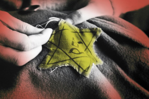 old photograph of sewing on a Jewish star