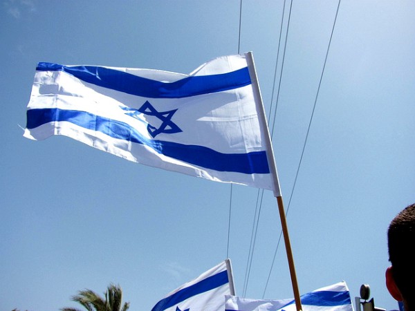 The Israeli flag is held high in celebration of the rebirth of Israel,