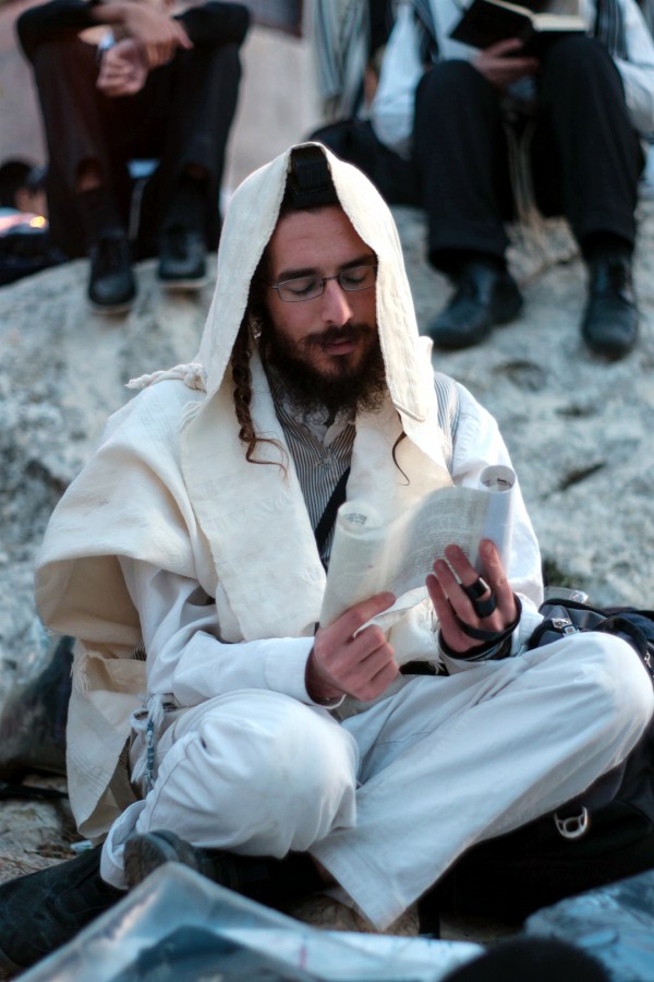 A Jewish man in Meron rises early to pray Shacharit (morning prayer) on Lag BaOmer.