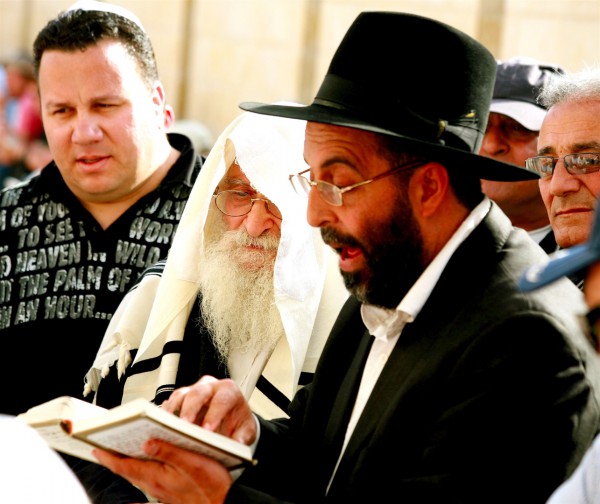 An ultra-Orthodox Jewish man prays at the Western (Wailing) Wall.  (Photo by opalpeterliu)