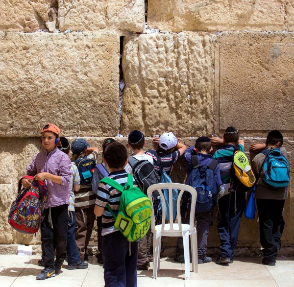 Jewish boys pray at the Western (Wailing) Wall.