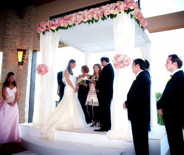 A Jewish wedding is conducted under the chuppah, which symbolizes the home the couple will build together.