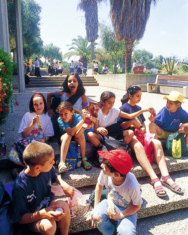 Israeli school children take a break during a school field trip.