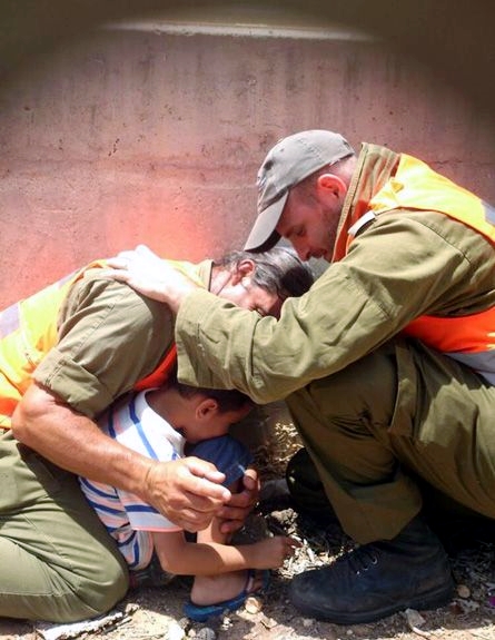 IDF officers shield a 4-year-old boy, protecting him with their own bodies during a Hamas rocket attack