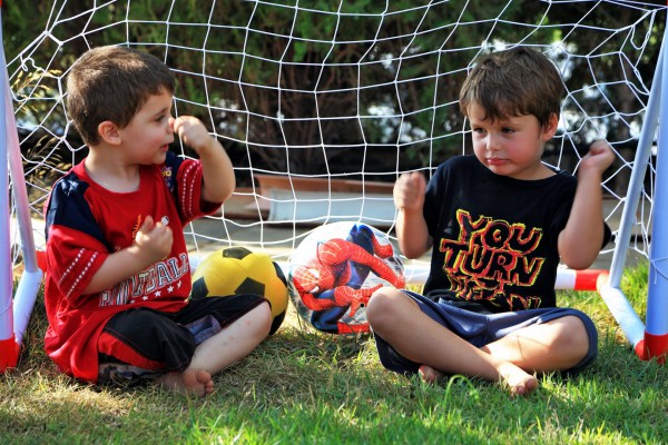 Two four-year-old Israeli boys discuss football (soccer).