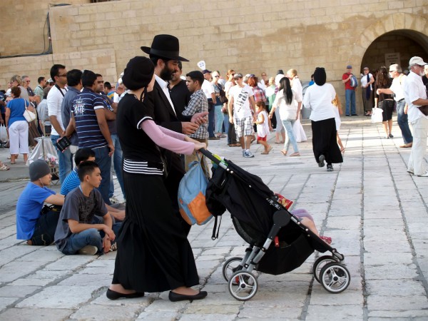 An Orthodox Jewish father and mother in Jerusalem.