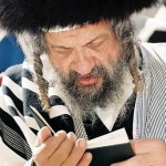 A Jewish man recites prayers.