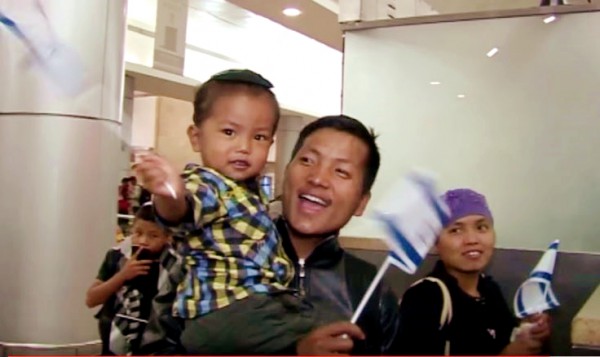 A Bnei Manashe couple immigrates to Israel with their child.  (YouTube capture)