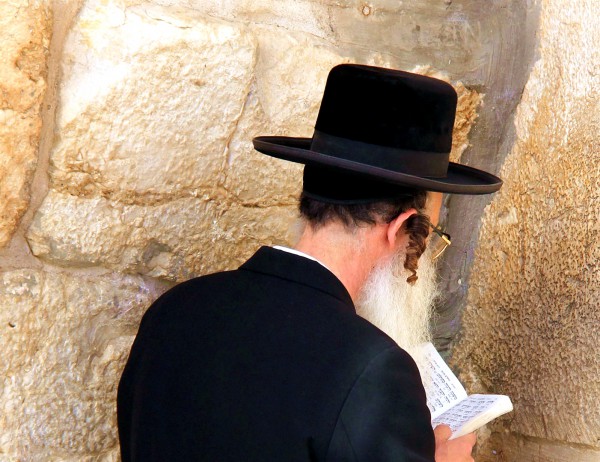 An ultra-Orthodox Jewish man with payot (sidecurls) prays at the Western (Wailing) Wall.