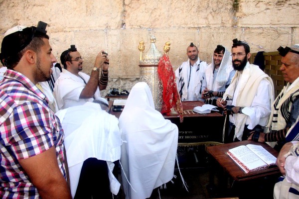 A 13-year-old Jewish boy prepares to read the Torah at the Western Wall. (Photo by Peter van der Sluijs)