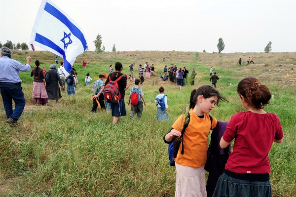 Israeli children plant trees on Tu B'Shvat.