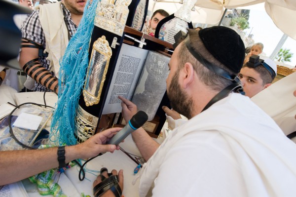 Reading from the Torah at the Western (Wailing) Wall.