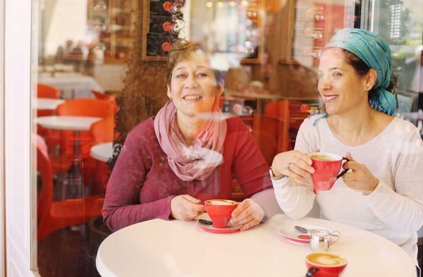 Jewish women chat in an Israeli cafe.