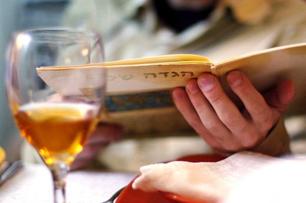 Reading a Passover haggadah